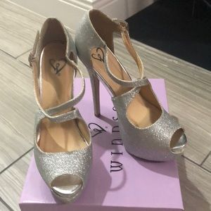 Windsor size 7.5 silver sparkly platform heels.